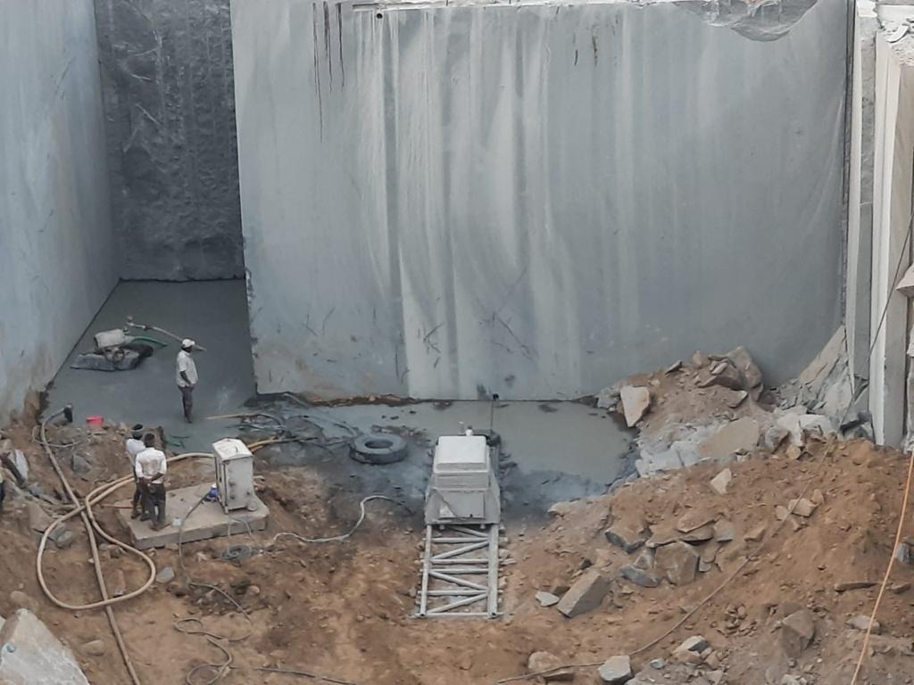 Diamond wire-saw cutting operation inside granite quarry pit